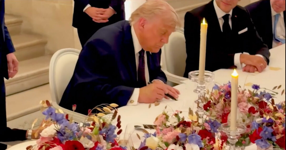 trump signing versailles 1200x630.jpg